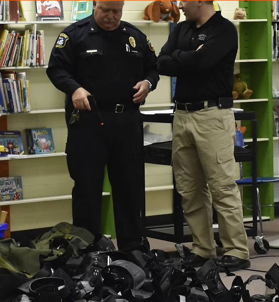 Instructors preparing training equipment